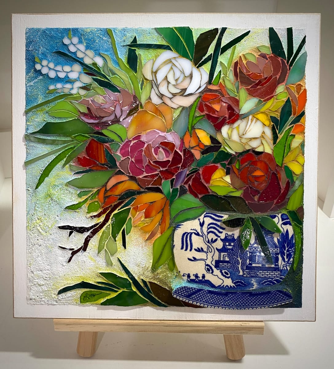 Comfortable Beauty by Laura McKellar  Image: A Blue Willow vase complements this warm floral bouquet
