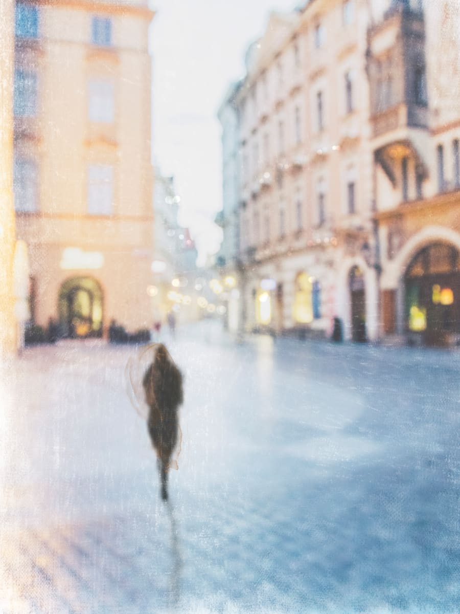 Prague Evening by Wendy Baker  Image: Woman walking in Old Town Prague, Czech Republic