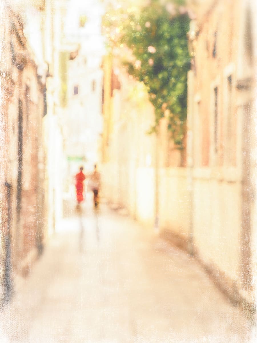 Stroll in Venice by Wendy Baker  Image: Two woman strolling down a narrow, sunlit alley in Venice, Italy