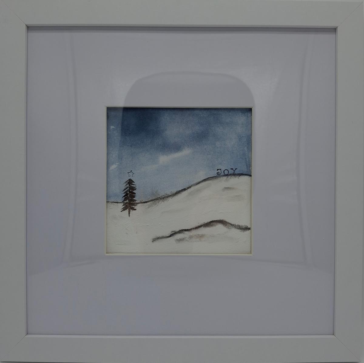 Christmas Joy 1 by Amanda Craig  Image: Mixed media Christmas scene original showing a tree with a star on a snowy backdrop, with the word "Joy" for the Christmas season. This piece is framed and ready to hang on the wall.