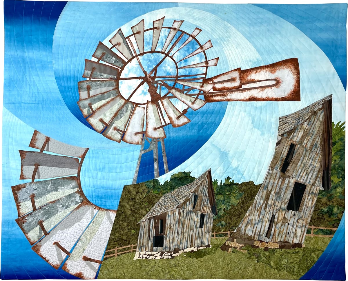 In the Wind by Michelle Jackson  Image: The windmill is still found on rural ranches and small farms across the American plains. It harnesses the power of the wind and most pump water and mean life and civilization. Wind and harsh weather cause decay and aging over time and can sometimes distort the things around us making it seem as if buildings are swaying or falling. 