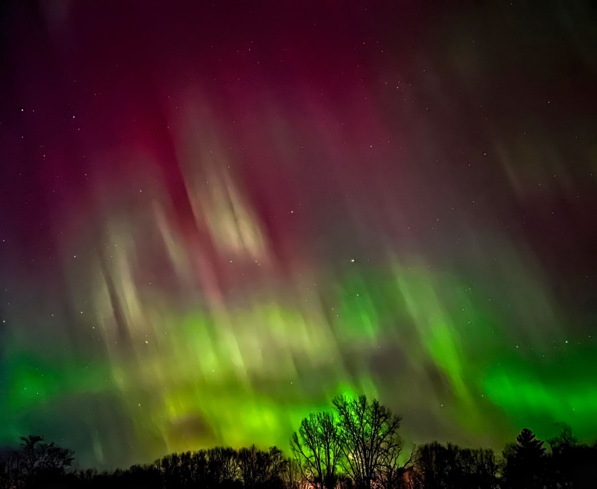 Aurora Nights by Lisa Drew  Image: Photographed in Minnesota.  White mat, black frame, wire hanger, glass.