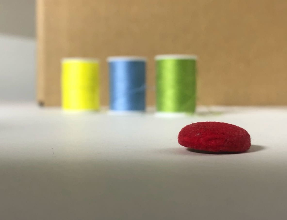 A lone button by Trevor Rowe, Image 1.