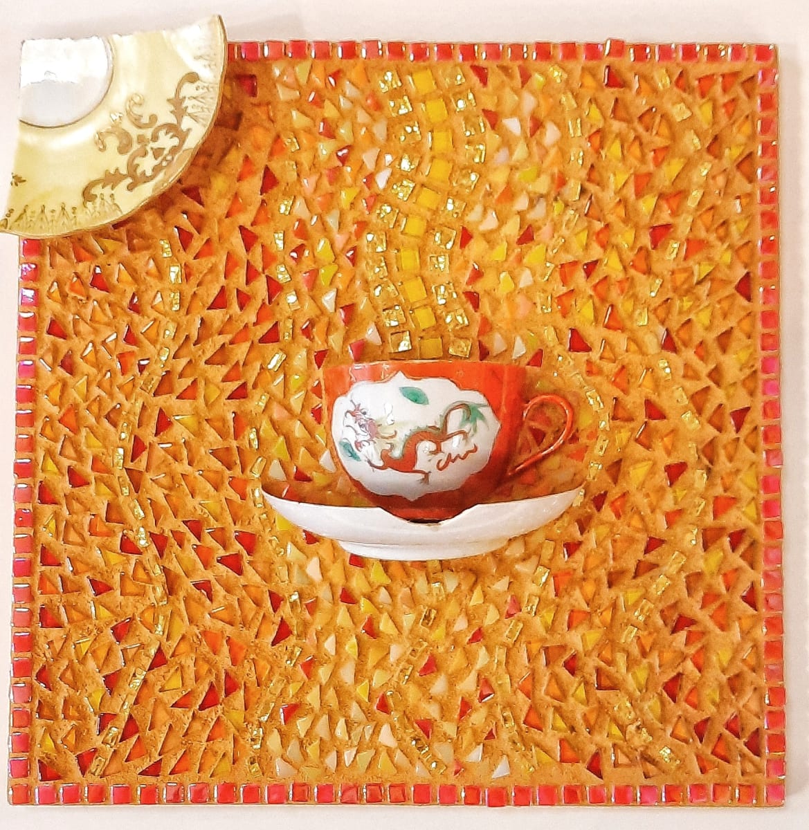 Tea Cup Mosaic by Emily Stevens  Image: Mosaic made from antique tea cup and saucers with glass tiles 