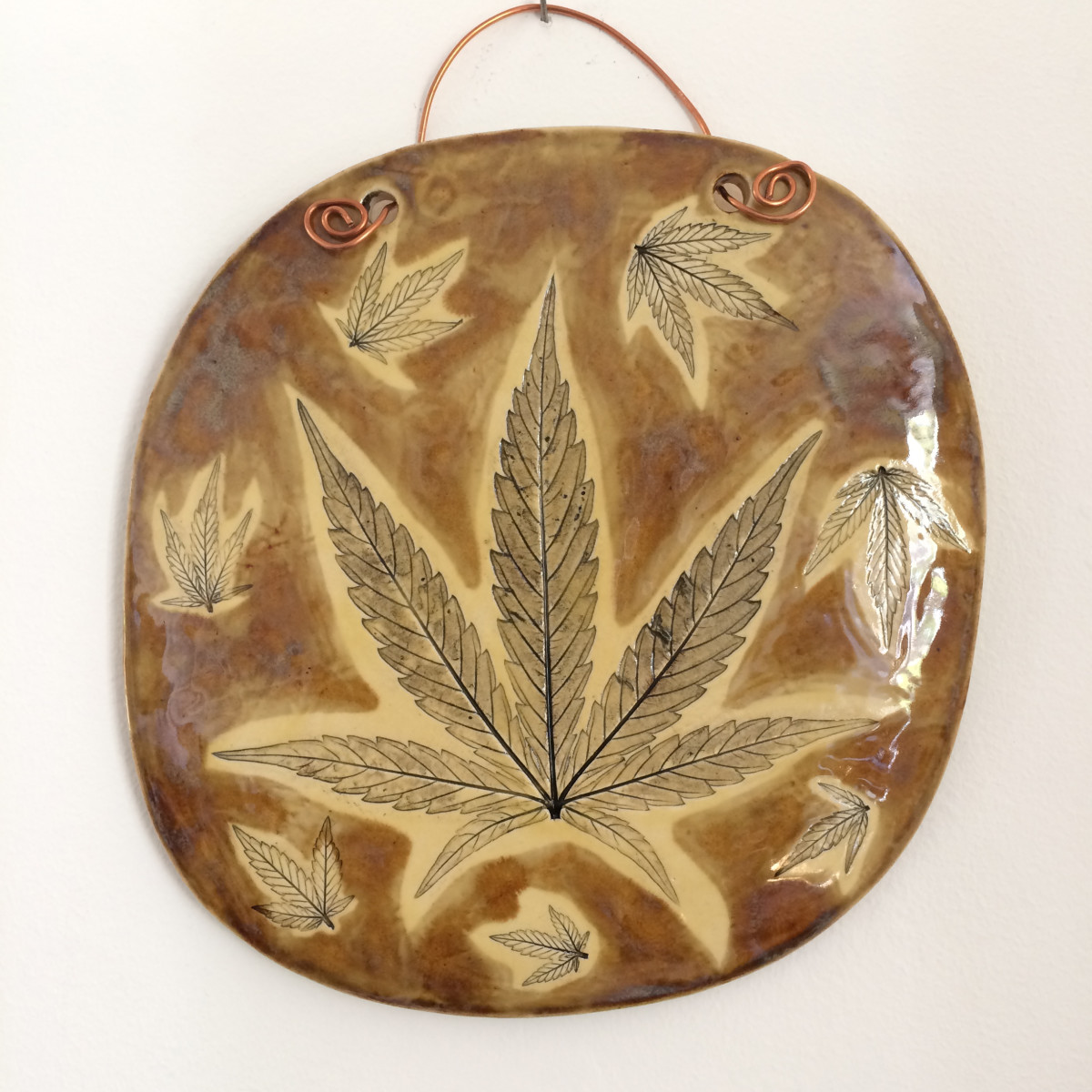 Warm honey leaf impression wall hanging by Nell Eakin 
