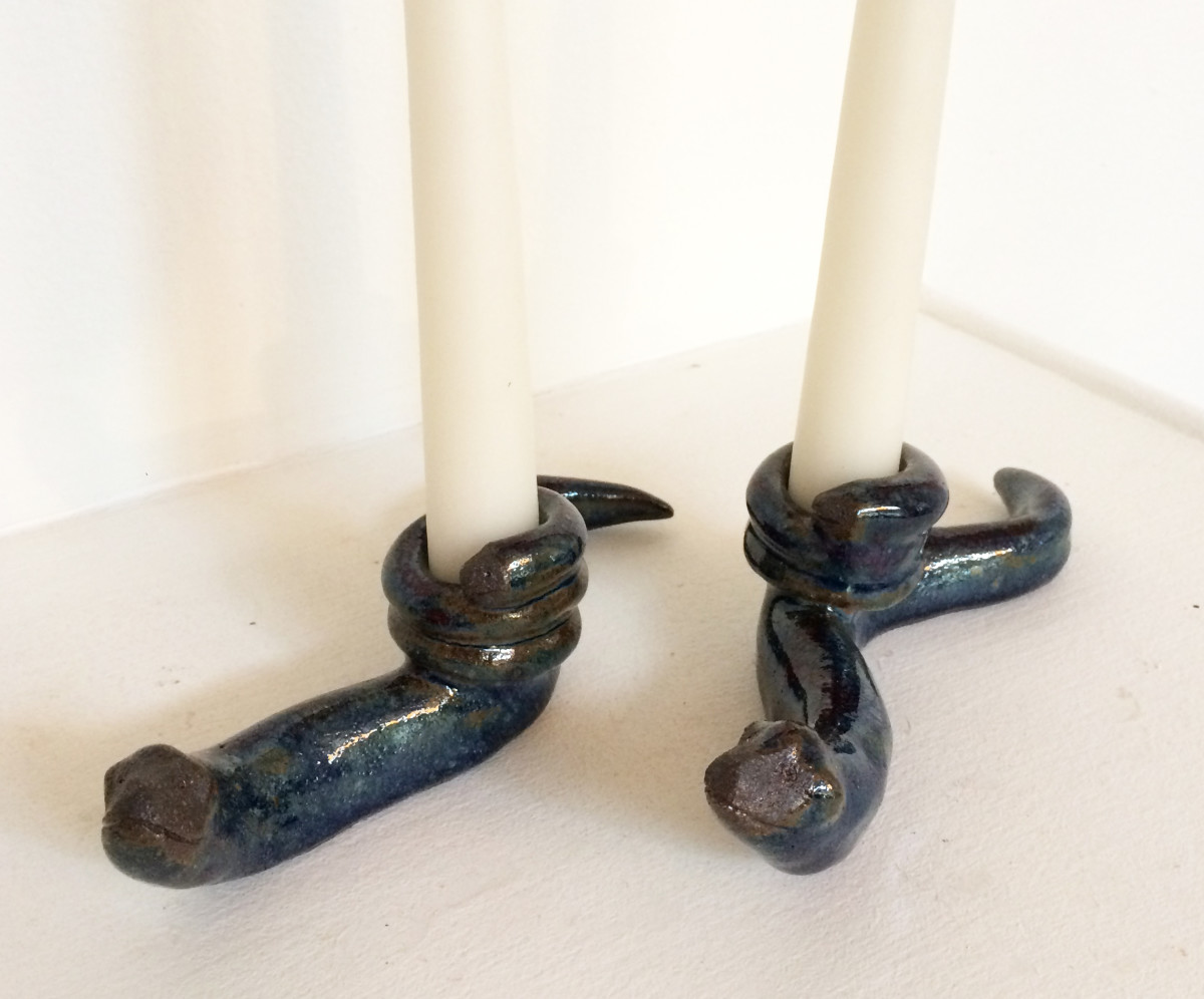 Dark blue slithering snake candle holders by Nell Eakin 