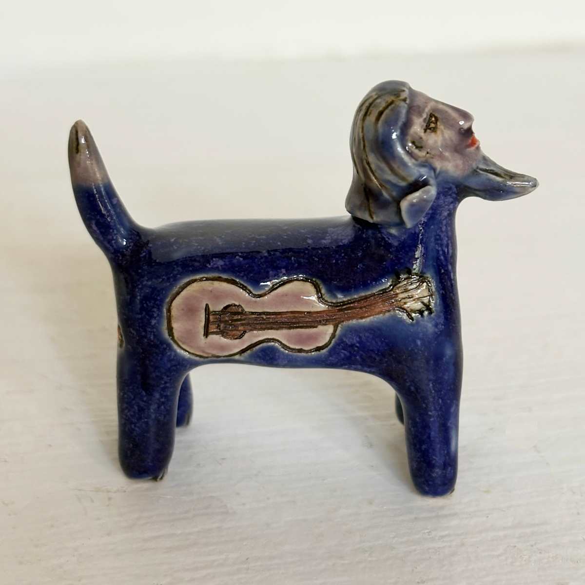 Sharp Blue Guitar Man,  a teenie by Nell Eakin 