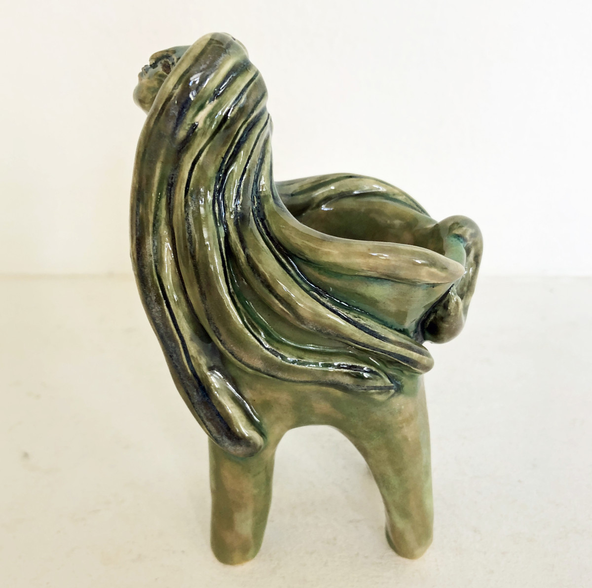Green lady with long locks bowl by Nell Eakin 