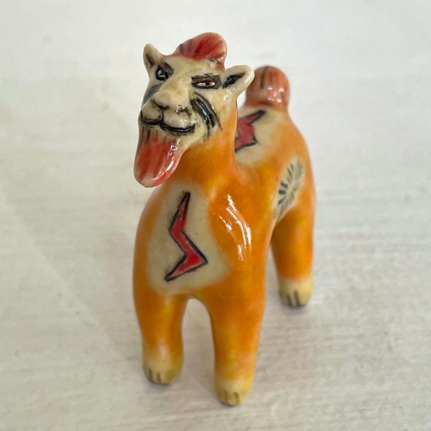 Electric Orange Lion, with beard, a teenie by Nell Eakin 