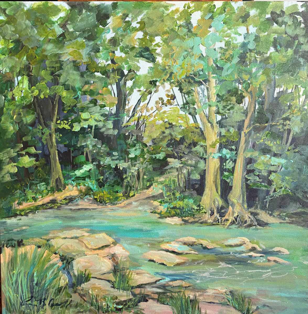 Creekside at Cataract Falls by Amy B. Carroll  Image: Painted on a bright summer day at Indiana’s Cataract Falls, Creekside at Cataract captures the quiet charm of a shallow, bubbling stream just upstream from the rushing falls. Sunlight dances on the water’s surface, framed by sturdy trees and dappled leaves. As I painted, my youngest son, Zac, explored the trails and helped carry my gear—turning the day into not just a plein air session, but a cherished memory. Later, we visited DePauw University, making it a perfect summer adventure before he headed back to school