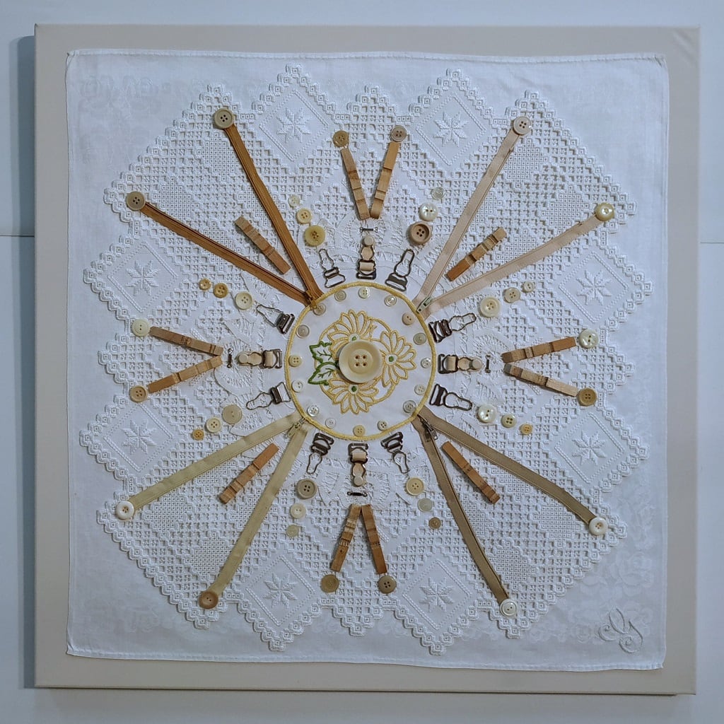 Laundry Mantra: Mind the Haberdashery by Lesley Turner  Image: Lesley Turner, 'Laundry Mantra: Mind the Haberdashery', 2021, 26" x 26". Vintage cotton domestic linens, zippers, buttons, metal hooks, metal clothes pegs, polyester thread. This mantra inspires mindfulness in preserving delicate life connections, symbolized by a launderer's attention to haberdashery details.