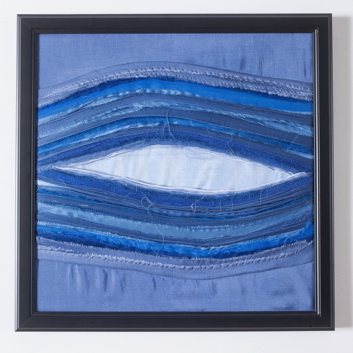 Synesthesia #11 Blue by Lesley Turner  Image: Lesley Turner, 'Synesthesia #11 Blue', 2017, 13"x13"x0.5". Silk and nylon fabrics, cotton and polyester threads. Working monochromatically I focused on expressing the color’s radiating energy through line and value.  Photo: Tony Bounsall Photo-Design
