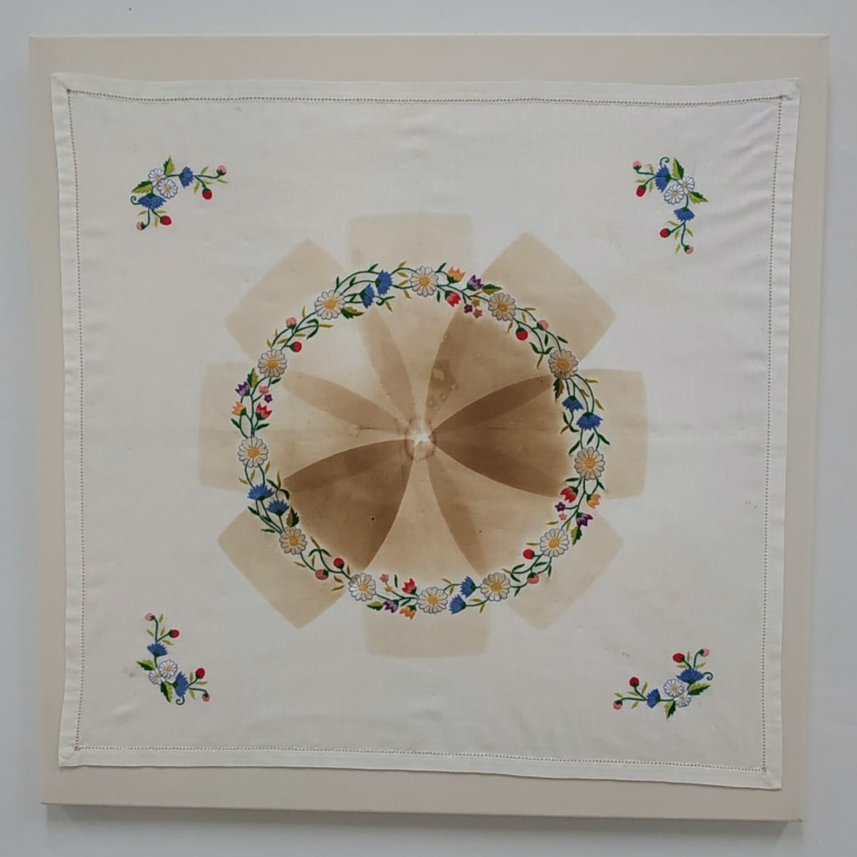 Scorch: Meditation by Lesley Turner  Image: Lesley Turner, 'Scorch: Meditation', 2020, 28"x28". Vintage tea cloth, bedsheet, polyester thread. A mandala of scorch marks ironically serves as a form of meditation for the launderer.