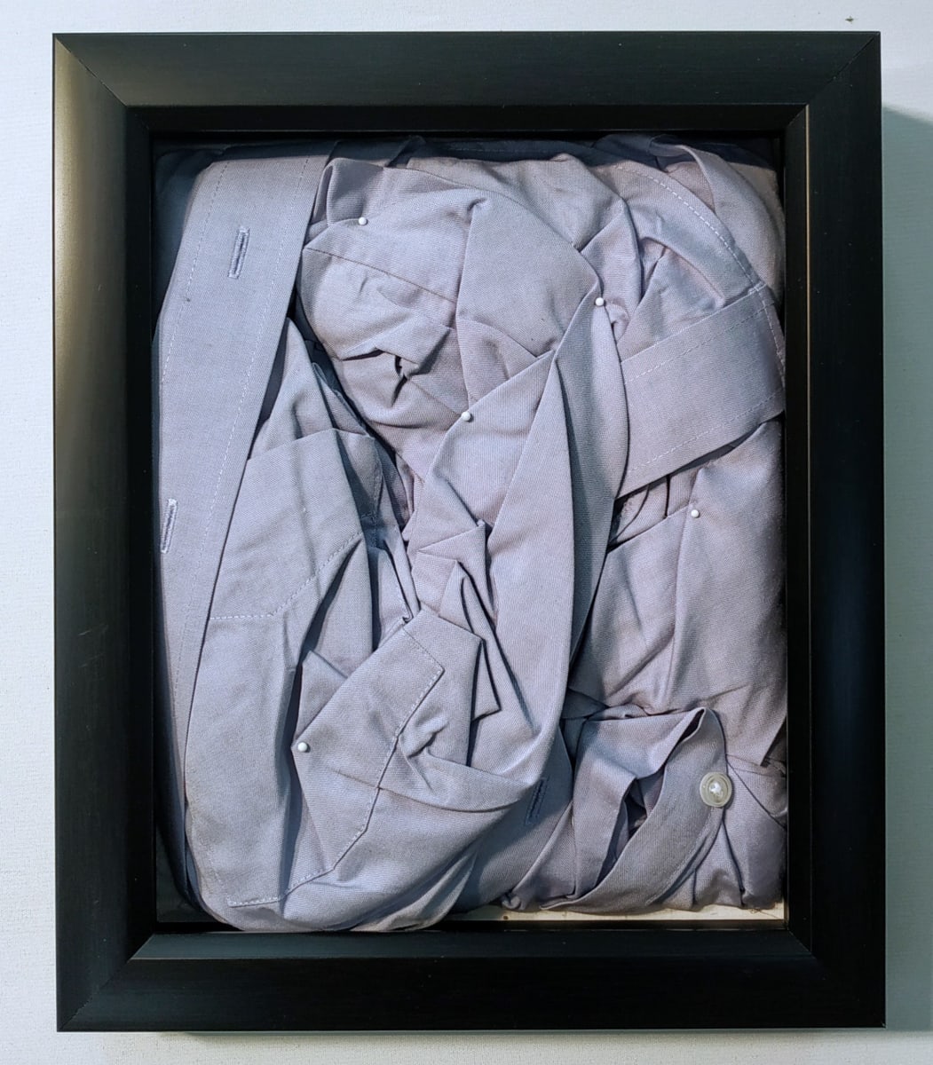Boxed Shirt by Lesley Turner  Image: Lesley Turner, 'Boxed Shirt', 2022, 12"x10". Men's cotton business shirts, plastic buttons, metal pins. Once, fine shirts arrived folded in boxes, pins securing the wearer’s power and prestige.