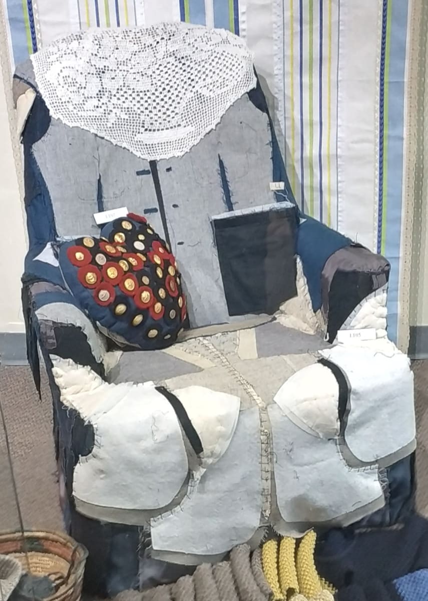 Battle Fatigue/s by Lesley Turner  Image: Lesley Turner, 'Battle Fatigue/s', 2018, 37"h x 28"w x 34"d. An upholstered chair is covered with military uniforms.