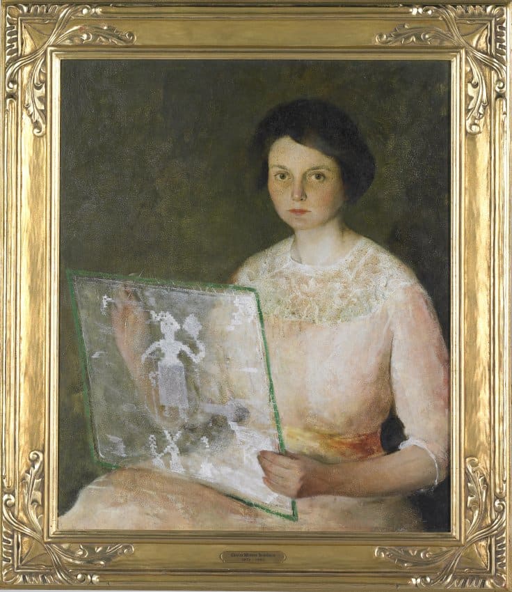 Woman in Peach Sewing 