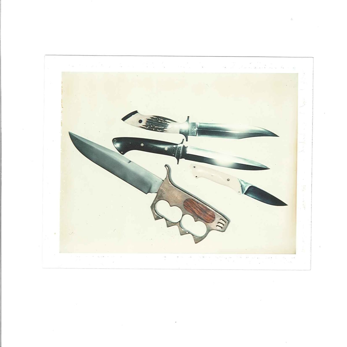 Knives
Valentino and Unidentified Woman, 8/1975 by Andy Warhol 