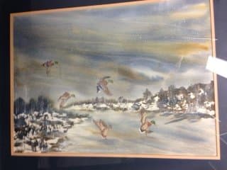 Ducks flying in snow 