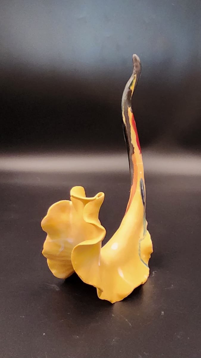 Tail of True Colors by Sylvie Pool Alvarez  Image: "Tail of True Colors" 
Read My Tail Series 
White stoneware clay, glaze 
7.5h x 5w x 2.5d inches
