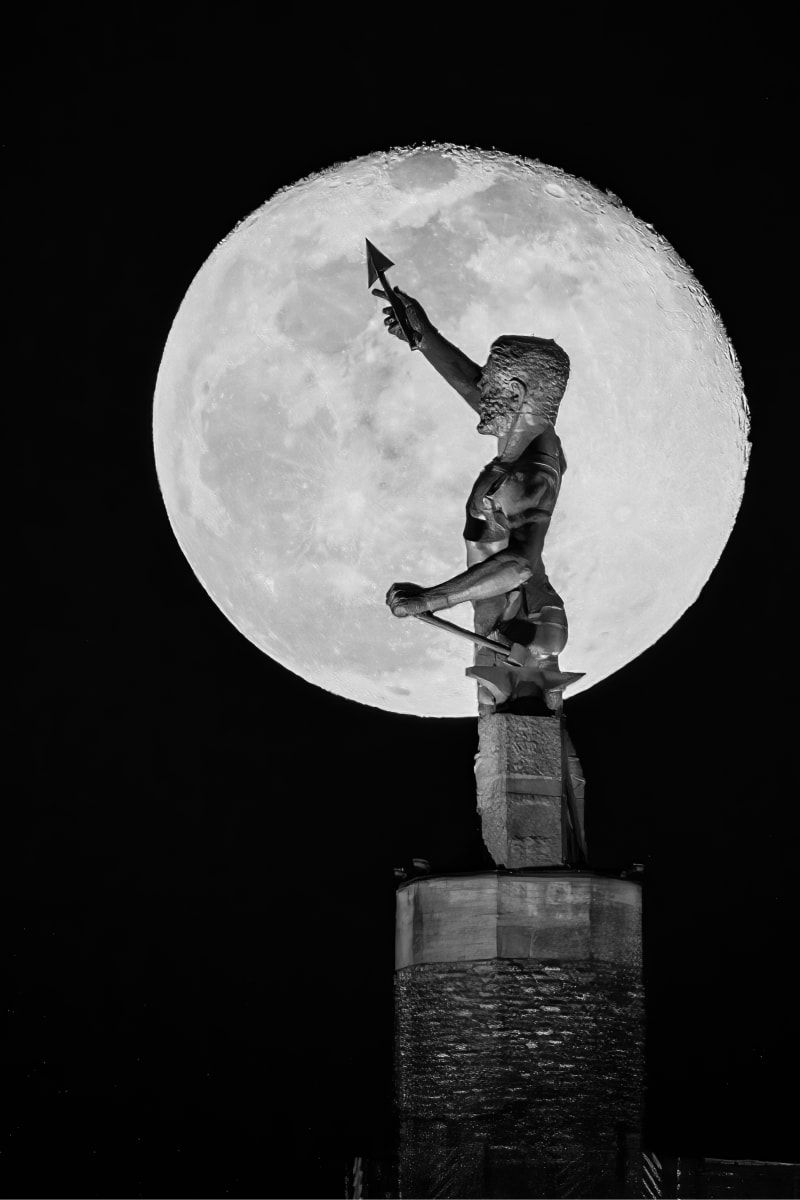 Vulcan, Birmingham by Earl Todd  Image: This is a single shot and does not use Photoshop to enhance the moon. I was a little over 3/4 of a mile from Vulcan. Using a long telephoto lens creates this effect.