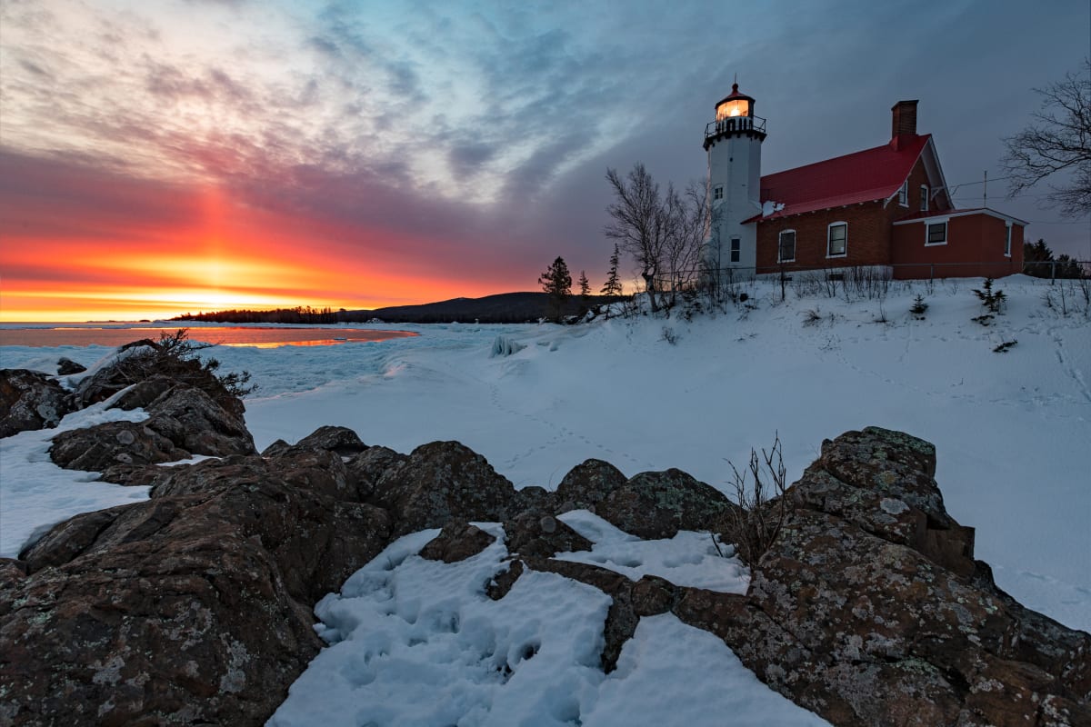 Eagle Harbor Lighthouse, Eagle Harbor, MI by Earl Todd  Image: This is an operating lighthouse located in Eagle Harbor in the upper peninsula of Michigan on Lake Superior.  This image was captured at sunrise in March 2022.