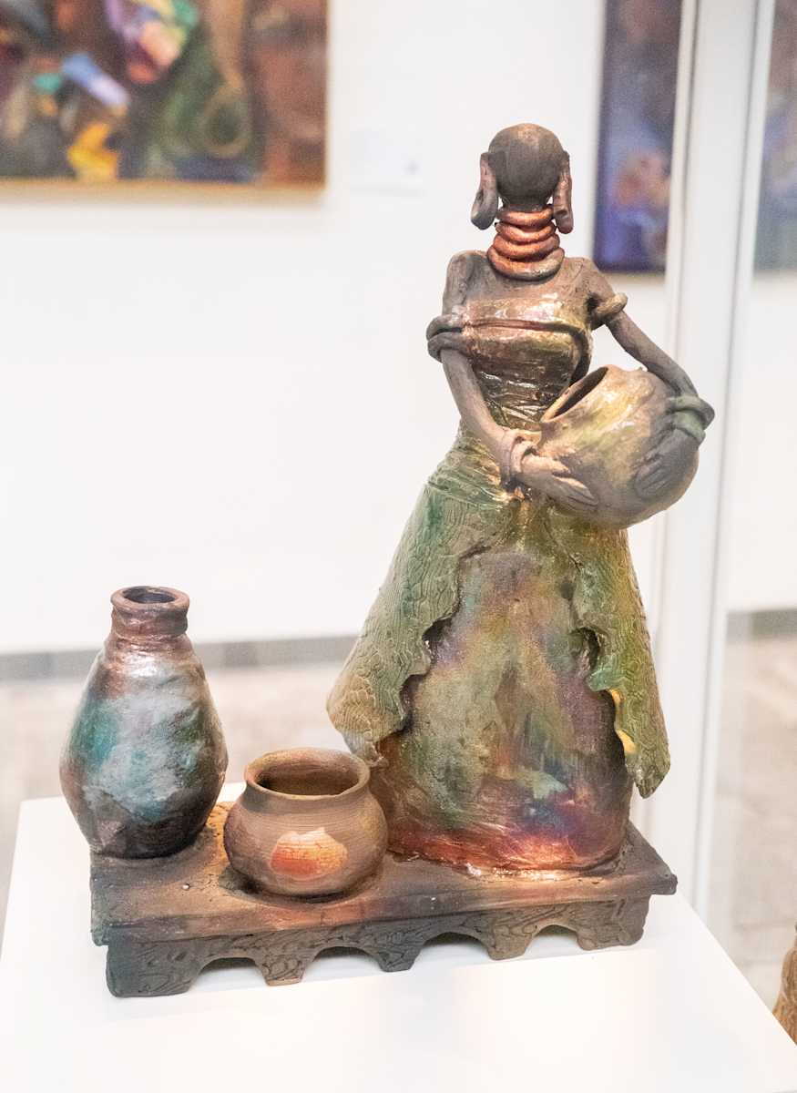 African Lady with Pots by Yvonne Stubbs 