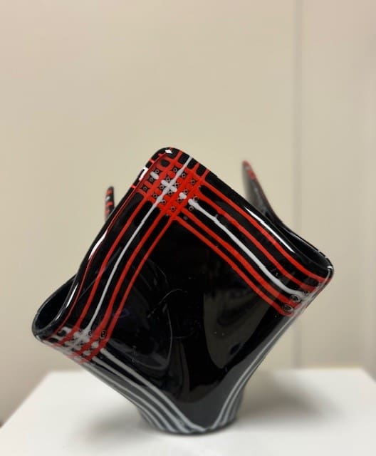 Blanket Lines by Jay Laxton  Image: Black Glass with Red and White glass rods fused together to emulate an old style blanket