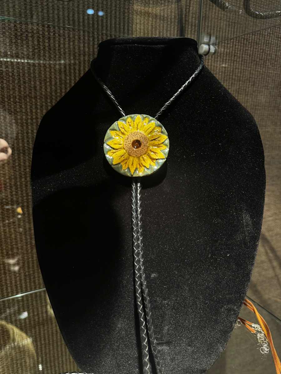 Sunflower Bolo by Jay Laxton  Image: Ceramic bolo tie with sunflower design