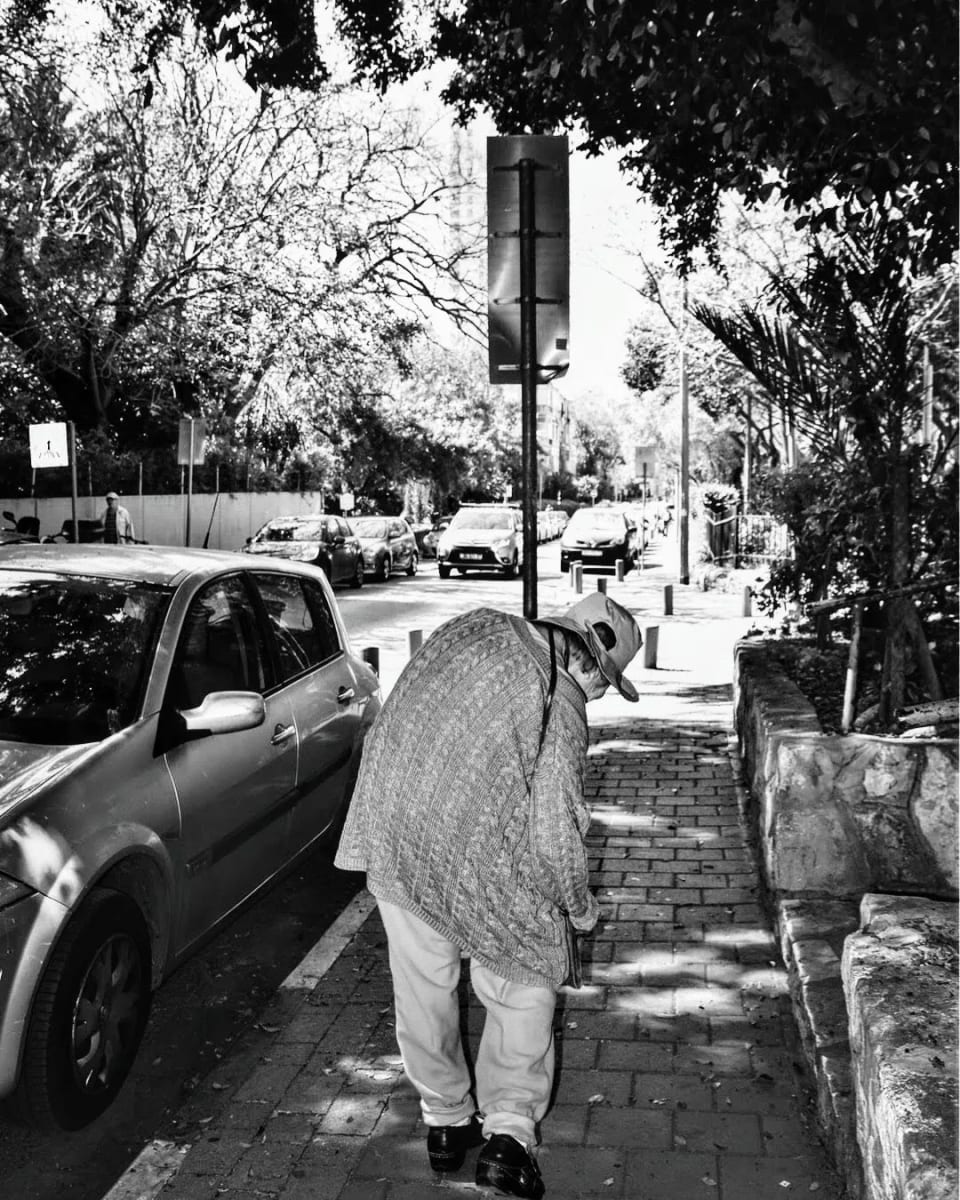 Crouching over by Anat Ambar 