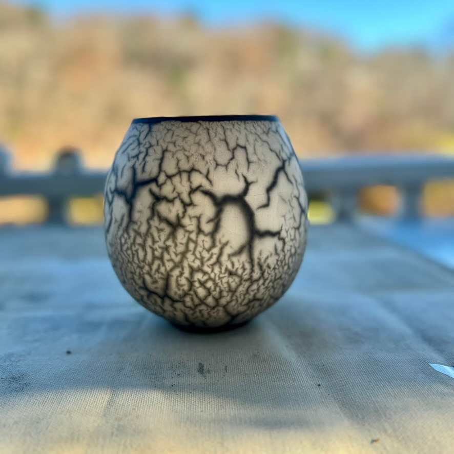 Naked Raku #1 by Jennifer K Brown  Image: Naked Raku #1, out of the fire and onto the porch for its beauty treatment. 