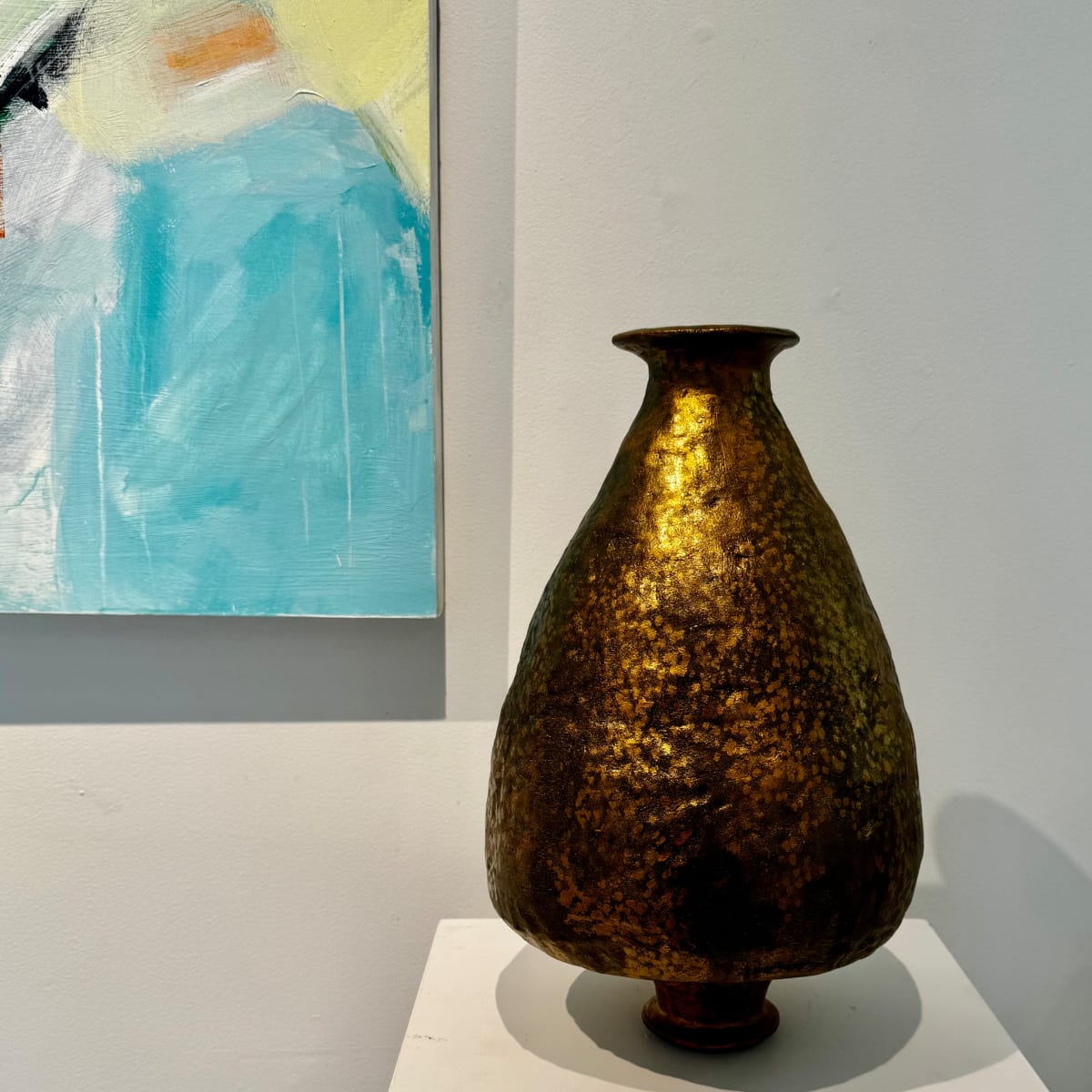 Gilded Matriarch by Jennifer K Brown  Image: The ceramic vessel that traveled to a juried show in Paris for Design Week 2023 received a new cold finish of gold enamel during the Summer 2024 Olympics. 