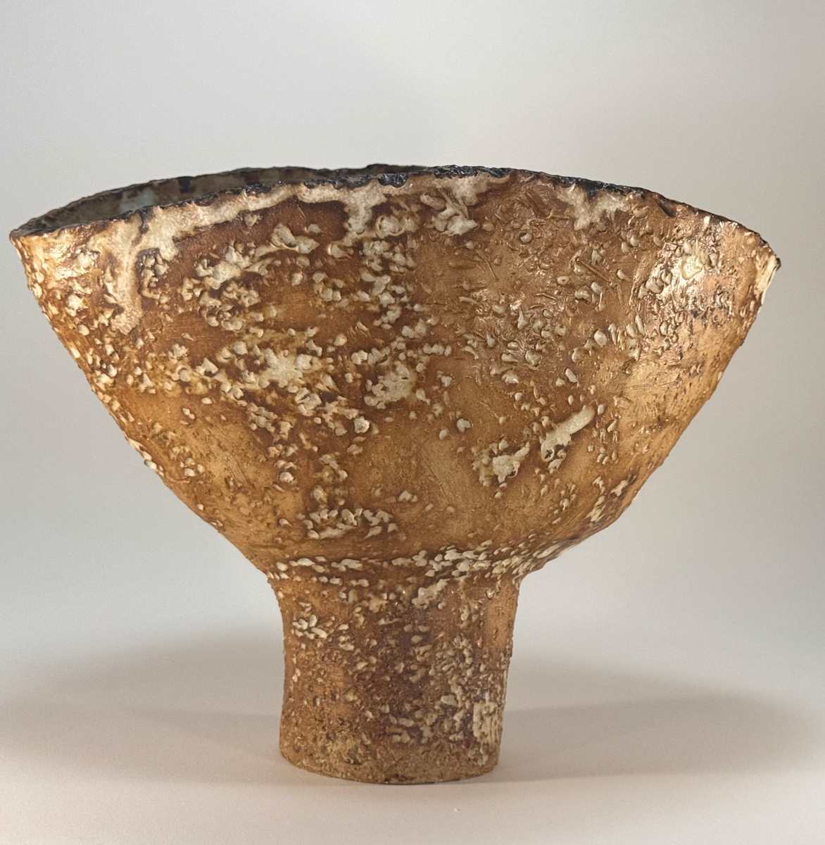 Sturdy Boy Squeeze by Jennifer K Brown  Image: I created this “new” artifact using traditional techniques to resemble the fragment of an ancient storage jar, unearthed on an archaeological dig. Makes a stunning display filled with fresh flowers! 

Donated to the Newburyport Art Association juried auction Sept. 2025