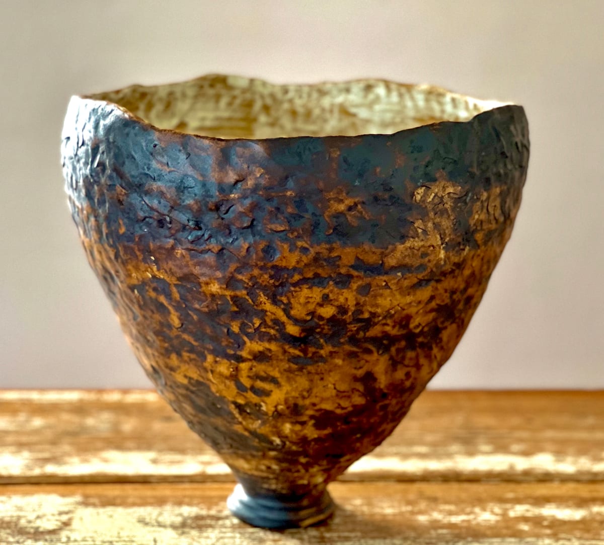 Vessel for an Armful of Justice by Jennifer K Brown  Image: Hand-built using traditional methods; exterior stained with manganese dioxide; interior brush-glazed with matte white.