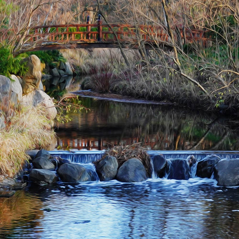 Under Bridge Over Rocks by Fletcher Hayes  Image: Photograph of a foot bridge within a Zen garden