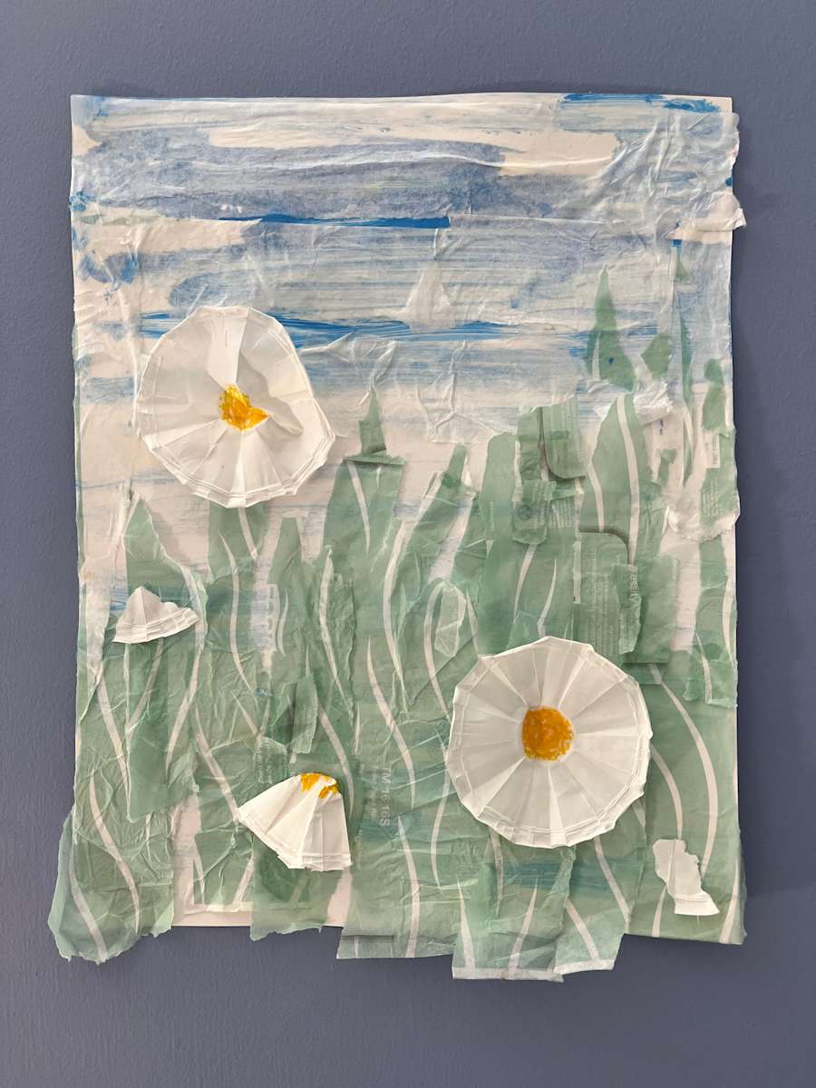Imagining Painting the Matilija Poppies by Lois Keller  Image: This work is both a reflection of nature’s power and a deeply personal record of healing. It reimagines the Matilija poppies I have painted in plein air with oil each spring. At 56, during my first experience seeking mental health support at a rehab center, I often closed my eyes and pictured myself standing among the towering blooms, finding calm in that memory when I felt overwhelmed. Using materials I found while staying there, including tissue and medication cups, I recreated that sense of serenity and harmony through this collage.