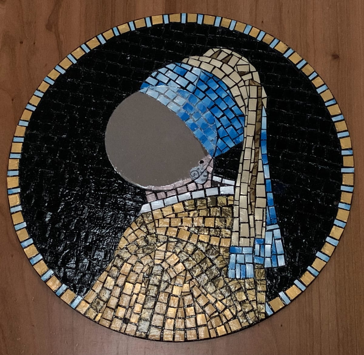 Girl with Pearl Earring mirror by Dina Afek  Image: The small round mirror allows anybody to see themselves in this iconic image.