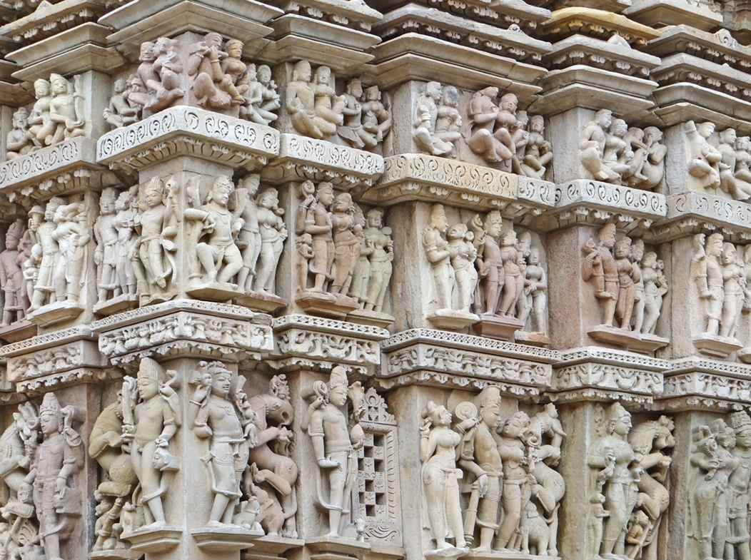 Scenes of amorous couples and celestials at Parshvanatha temple by Khajuraho Temple complex, Madhya Pradesh 