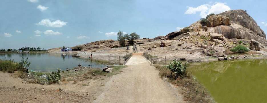 General View of Kalugumalai by Tamil Nadu  Image: The site of Kalugumalai is located in the Thoothukudi district in the Indian state of Tamil Nadu. Apart from two later rock-cut temples dedicated to Murugan and Shiva, Kalugumalai is well known for its bas reliefs (Kalugumalai Jain beds) on rock facades dedicated to Jain religious figures carved in the 9th-10th centuries and accompanied by inscriptions detailing patronage patterns. Here one notes the absence of interior spaces accompanying the reliefs, a feature found primarily in Tamil Nadu. The relief carvings are on a rocky outcrop roughly 600 feet above the town and serve as a landmark. There are roughly 150 relief carvings of Jinas, yakshas, yakshis, celestials, musicians and attendants. Lisa N.Owen in her recent study terms these as ‘boulder sites’ and highlights how these function as a sacred space even though one cannot experience the devotional aspect of entering a sanctum.