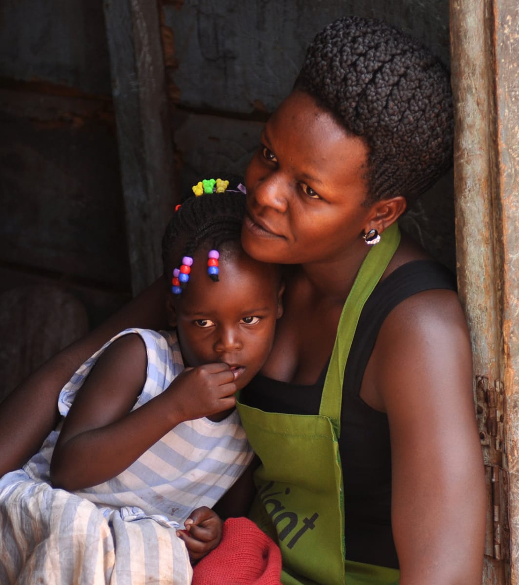 Shopkeeper & Daughter Taking a Rest by Bob Wilson 