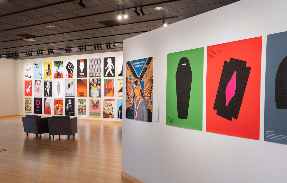 View of posters on white gallery walls