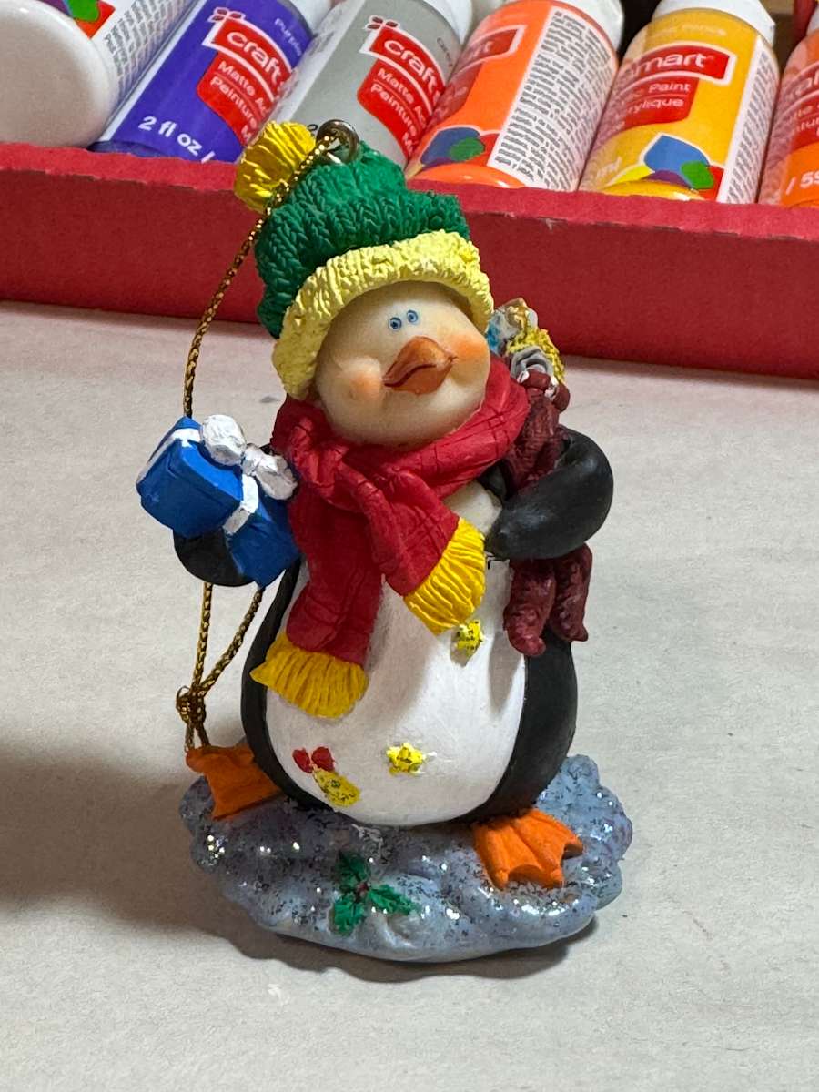 Penguin with package by David  H. L. Blackman, Ph. D. 