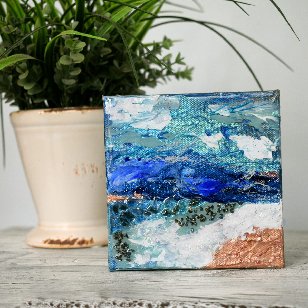 "Turbulence" by Dawn South  Image: From the “She Remains Untamed” Collection.
“Turbulence”
Mini canvas/Shelf Sitter
5″ x 5″ mixed media with resin