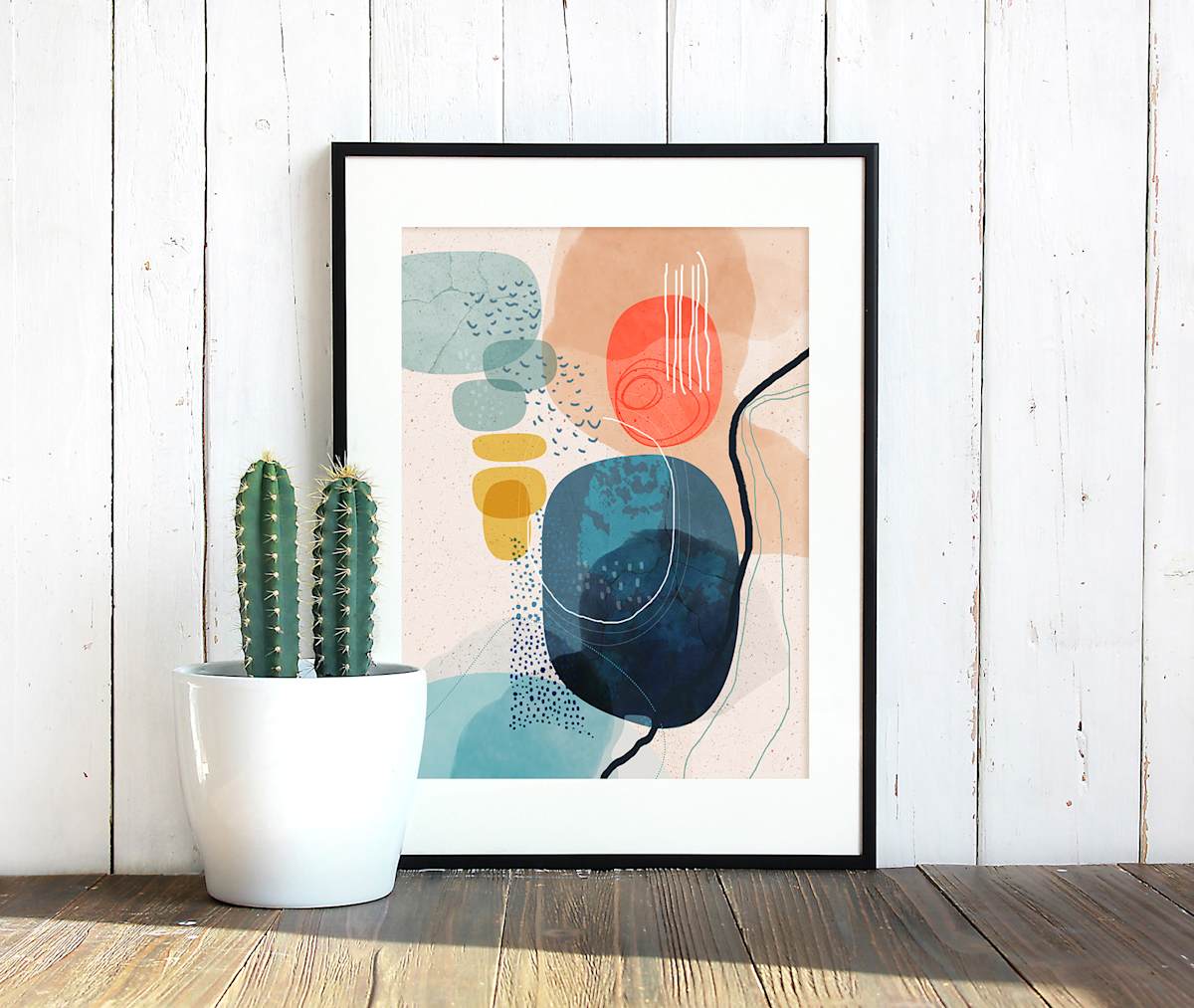 Prelude by Ishita Banerjee  Image: Prelude, Nature Landscape, Mid-Century Modern, Abstract, Fine Art Print by Ishita Banerjee, Soul Curry Art resting on a wooden floor with cactus