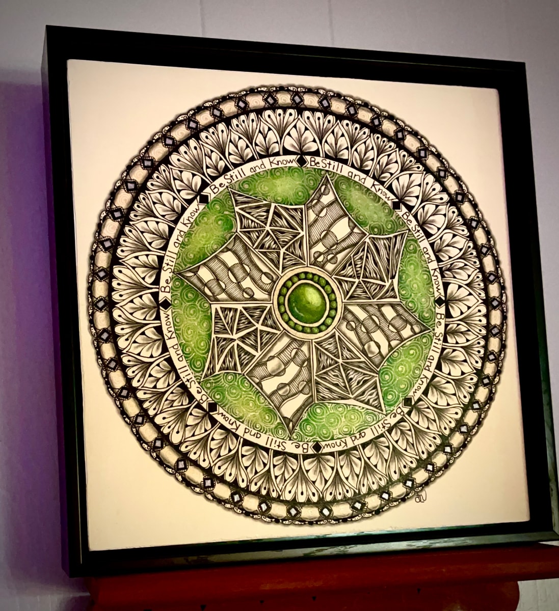 Be Still and Know Mandala by Donna Norton  Image: Mixed Media consisting of inks, colored pencils, and gel pens on paper, then on wood panel in a nice frame. 