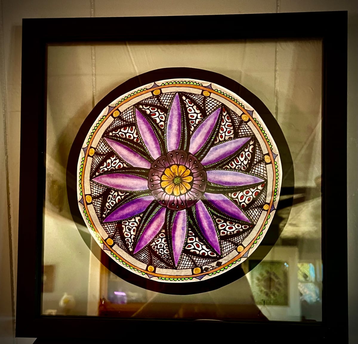 “Flower Caught in the Net” Mandala by Donna Norton  Image: This art is in a floating glass frame. 