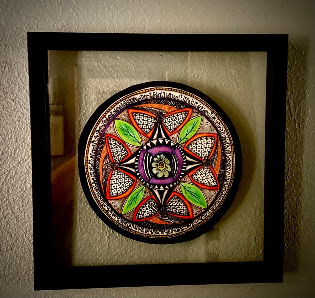 Bow Tie Mandala by Donna Norton  Image: This mandala is in a glass floating frame. 