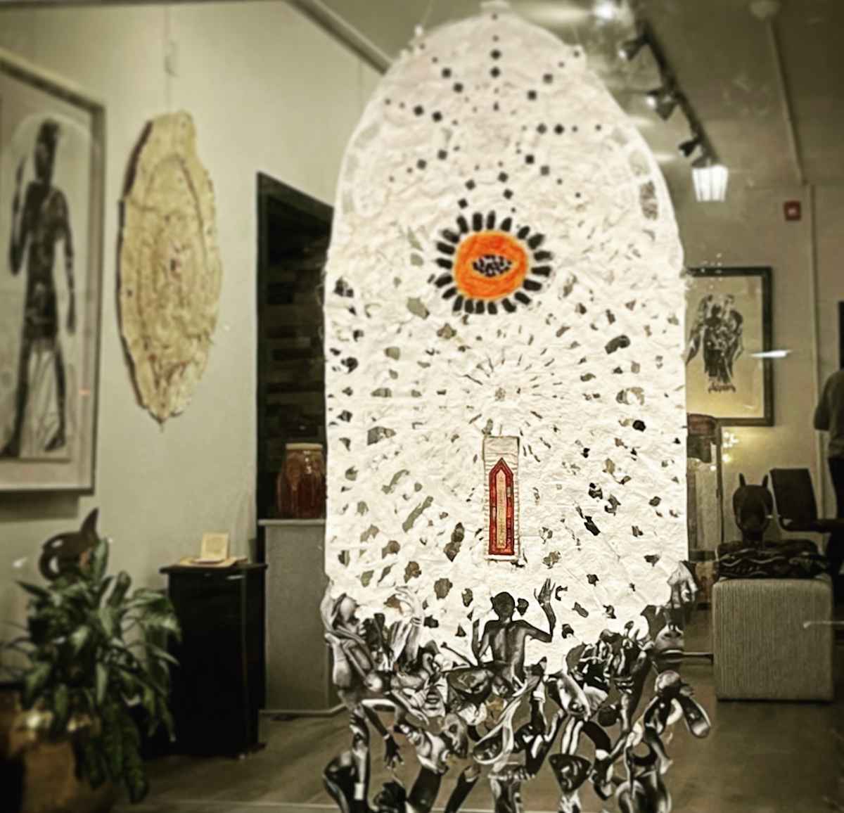 TRANSATLANTIC CROSSING - 2023 by ROSALIND NZINGA VAUGHN-NICHOL  Image: Instulation in gallery
“Transatlantic Crossing”2023. Poured pulp handmade paper structure with mirror and textile inclusions 6’6”H x 34”W. Part of an installation