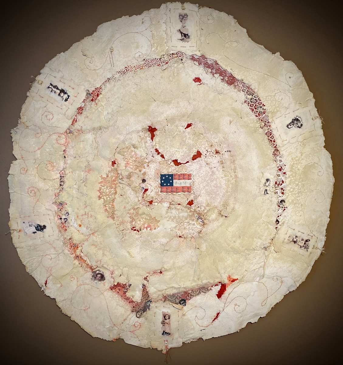 UNCLE TOM'S CABIN REVISITED by ROSALIND NZINGA VAUGHN-NICHOL  Image: UNCLE TOM'S CABIN REVISITED 2008  
Handmade paper collage quilt. Mixed media handmade paper, textiles, lace, and findings on reinforced paper base. , 40“ diameter x 1.0"d

(Comes with companion work: Uncle Tom’s Journal), mixed media hollowed out book: “Uncle Tom’s Cabin. 7” H x 5” W x 1.0 D
