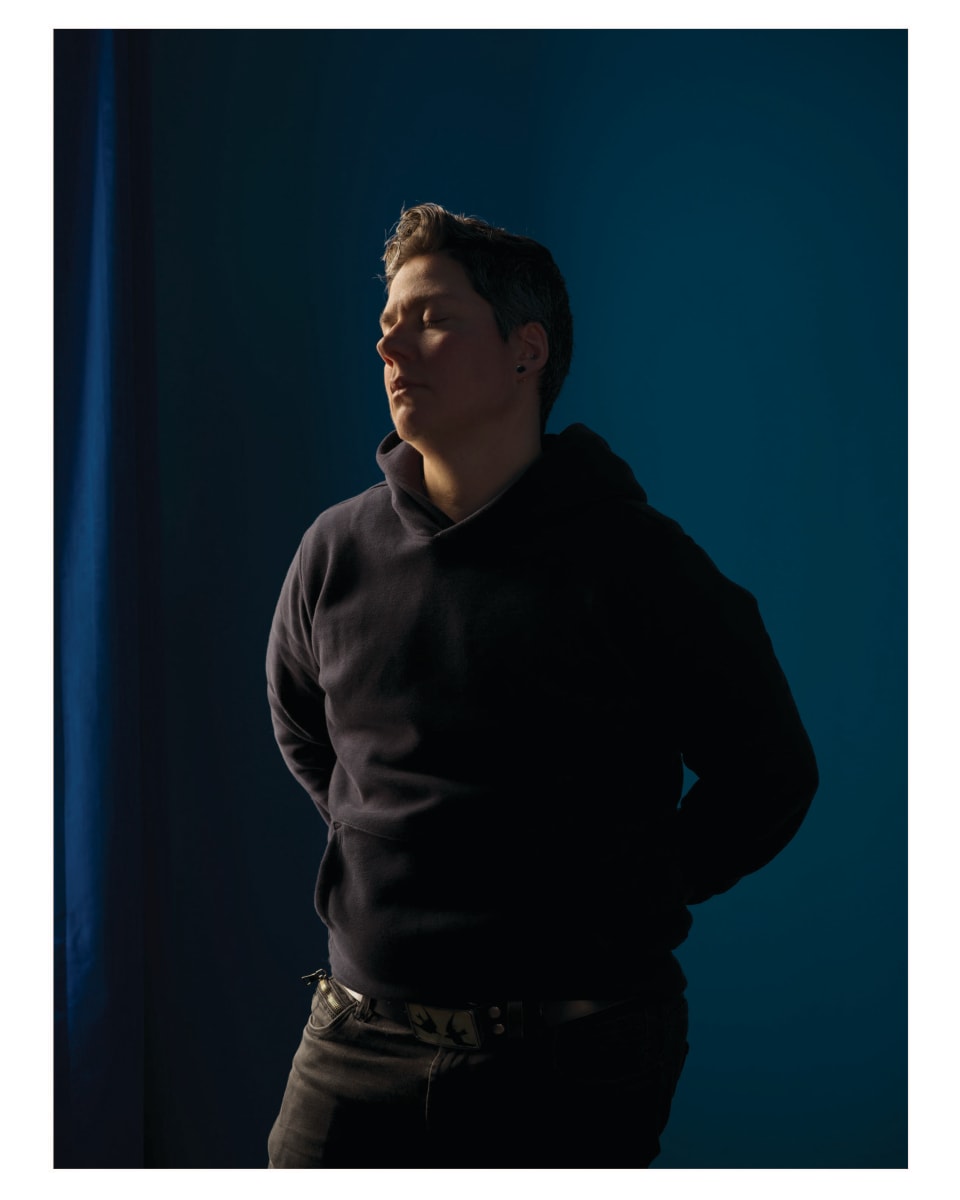 Self-portrait (blue room) by Jess Dugan 