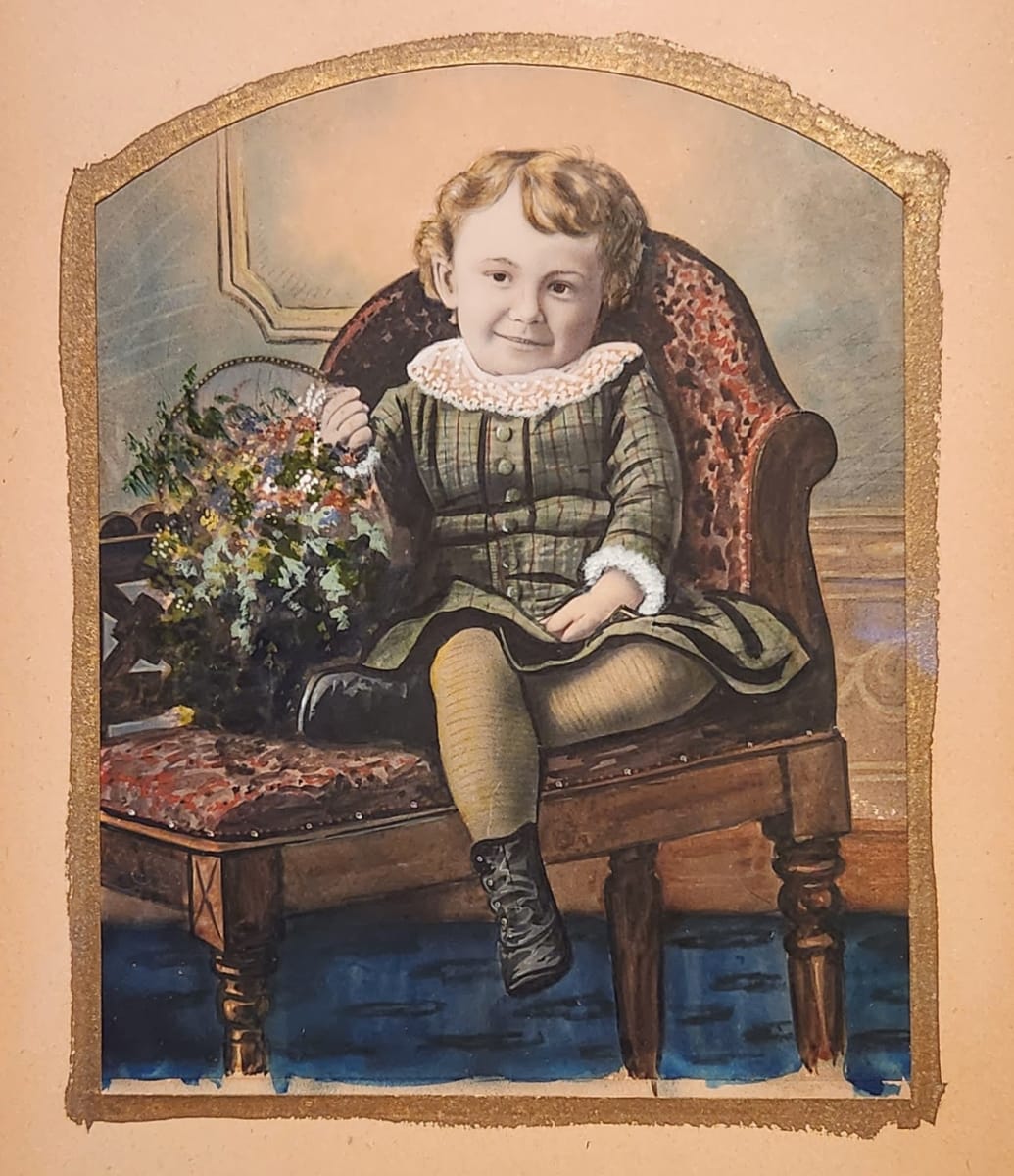 Seated child with flower basket 